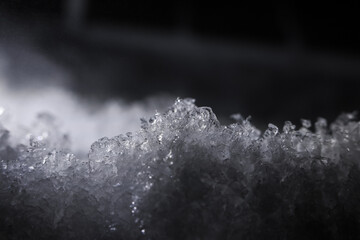 Macro image reveals frozen water intricate ice crystal texture. Cold winter scene highlights extreme frost detail, evoking chilly atmosphere. Pure water formation adds crisp appearance and deep