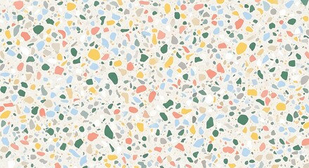 A full frame shot showing a terrazzo pattern with colorful chips on a light background surface