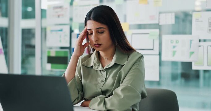 Laptop, stress and ux design with business woman at desk in office for development process. Computer, headache and prototype with mobile designer in workplace for planning or usability mistake