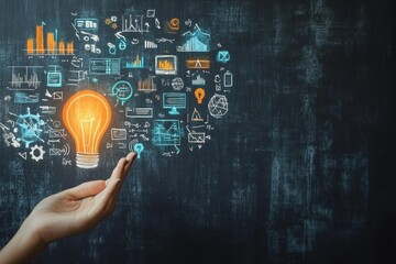 A hand reaching toward a glowing light bulb surrounded by digital icons on a blackboard backdrop
