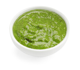 Fresh pesto sauce in bowl isolated on white
