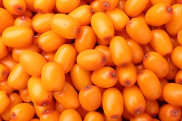 Fresh sea buckthorn berries as background, top view