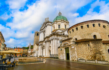 Brescia, Italy. Santa Maria Assunta Cathedral or Duomo Nuovo and Duomo Vecchio La Rotonda on Piazza Paolo VI with Torre del Pegol