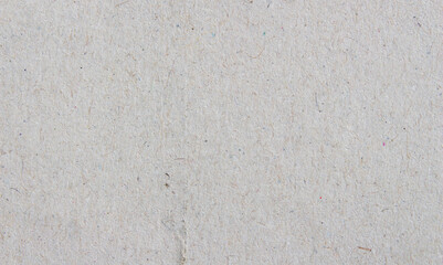 Recycled paper texture background. Rough grey sheet with natural fibers, eco friendly material for design and craft projects.