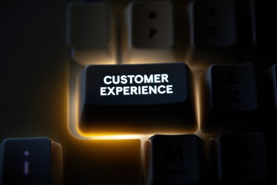 Illuminated customer experience key on dark keyboard for business