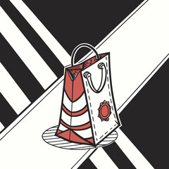 Red and white shopping bag on striped black and white background