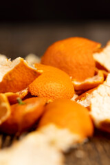 peel of peeled oranges closeup, a large amount of peel of peeled citrus fruits on the table, close up