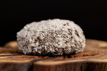 sweet marshmallows in chocolate sprinkled with coconut , sweet dessert marshmallows in milk chocolate with coconut