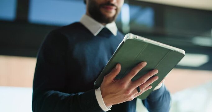 Hands, creative and man with tablet in office for research, proofreading article and update draft. Below, journalist and digital for editor feedback, review newsletter and information for publication