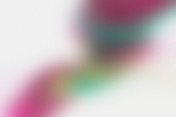 Soft, blurred abstract background with vibrant pink and green hues creating a dreamy, artistic effect.