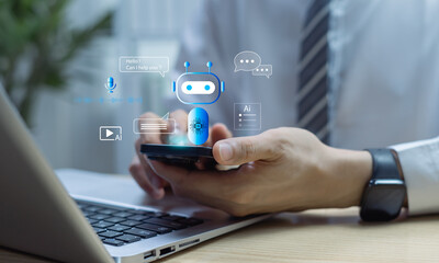 Chatbot and customer support concept with person using smartphone beside laptop, showing chat bubbles, call, and mic icons, representing AI assistant, automation, and omnichannel service.