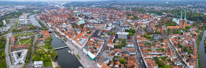 Obraz premium Aerial view around the old town of Lübeck in Germany on a cloudy autumn day