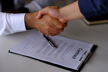 buyer and seller agreeing on contract terms