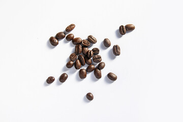 Top view of a decorative pile of coffee beans, isolated