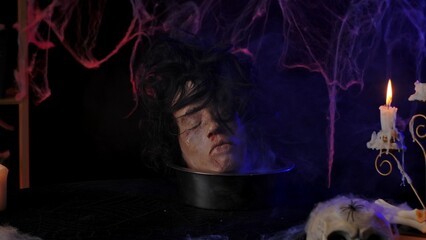 Eerie Halloween Table with Candle and Fake Head