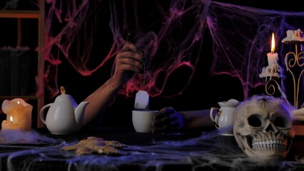 Spooky Halloween Tea Party with Candles and Skull