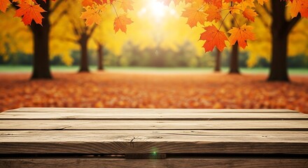 Empty rustic wooden table surface with a vibrant autumn forest and falling leaves in the background, perfect for seasonal product display concept