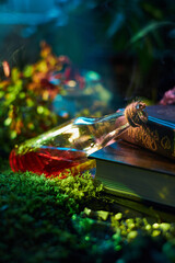 potion bottle filled with red liquid tilts beside a worn, ancient book on a bed of green moss. Soft light glimmers through surrounding plants, creating a magical atmosphere
