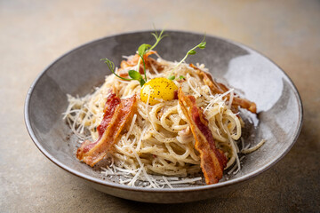 Classic spaghetti carbonara with bacon and egg yolk