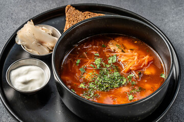 Ukrainian borscht soup with sour cream and herbs