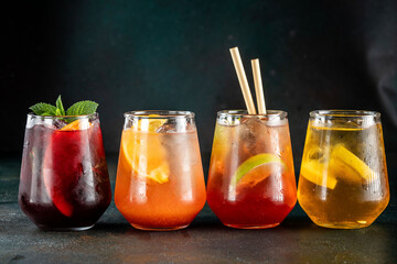 Colorful summer cocktails with ice and citrus