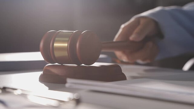 Law theme, mallet of the judge, law enforcement officers, evidence-based cases and documents taken into account.