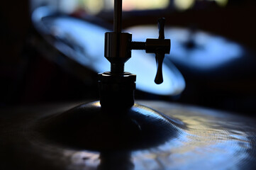Silhouette of a cymbal at close range