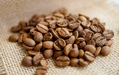 roasted coffee beans. coffee beans on sack.