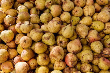 Fresh pears stacked in a market display