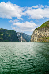 Scenic Naeroyfjord in Norway with towering cliffs