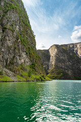 Tranquil waters and dramatic cliffs of the Naeroyfjord