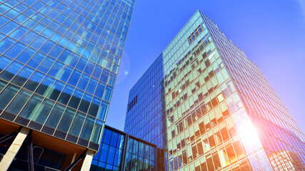 Bottom up view of  modern glass office building. Commercial real estate. New commercial office...