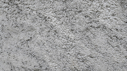 A textured gray concrete background.