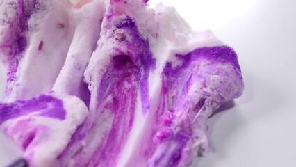 Fluffy slime with purple, pink, and white swirls. Cotton candy texture, soft and airy appearance...