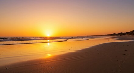 Obraz premium Beach Sunset with Waves and Sand
