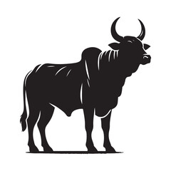 Silhouette of a majestic bull with prominent horns standing on a grassy field