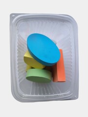 Colorful Pieces of Sidewalk Chalk in Plastic Container
