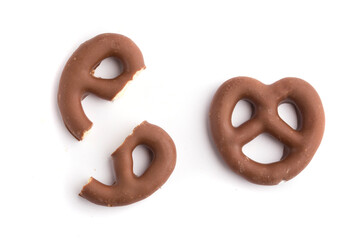 Chocolate German pretzels crumbs on a white background