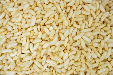 Indian Puffed rice or Murmure or Muri in Bengali. Wholegrain puffed rice, a popular bengali snacks as background, close up view isolated.