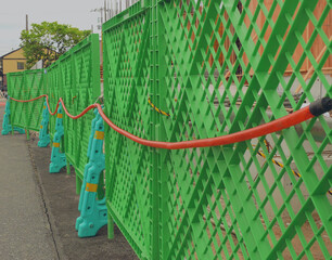 Plastic fences surrounding the construction site for safety.