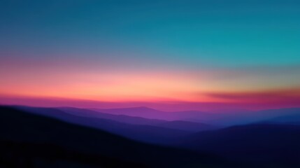 Obraz premium Colorful blurred landscape with layered mountain silhouettes under a vibrant sunset sky blending pink, purple, and blue hues