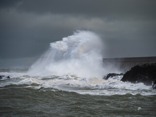 crashing waves over Holyhead breakwater isle of Anglesey