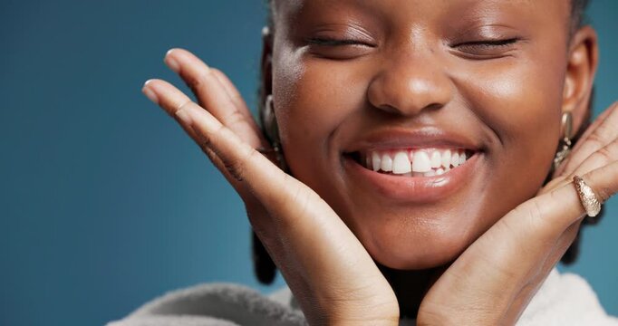 Dance, energy and smile of black woman in studio for celebration, birthday party or event. Freedom, hand gesture and music with happy African dancer on blue background for bonus or success as winner