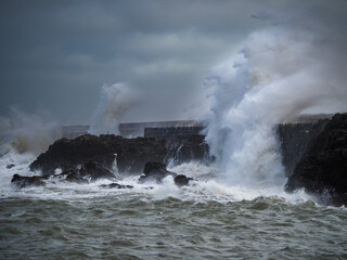crashing waves over Holyhead breakwater isle of Anglesey