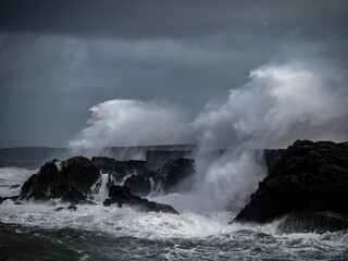 crashing waves over Holyhead breakwater isle of Anglesey