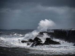 crashing waves over Holyhead breakwater isle of Anglesey