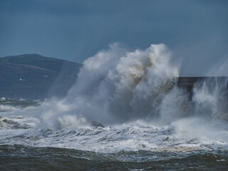 crashing waves over Holyhead breakwater isle of Anglesey
