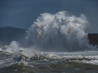 crashing waves over Holyhead breakwater isle of Anglesey