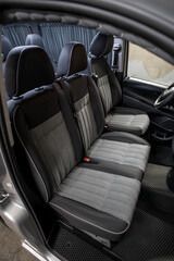 Fototapeta premium Comfortable interior of a passenger bus with soft seats