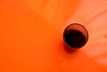 black coffee on an orange table